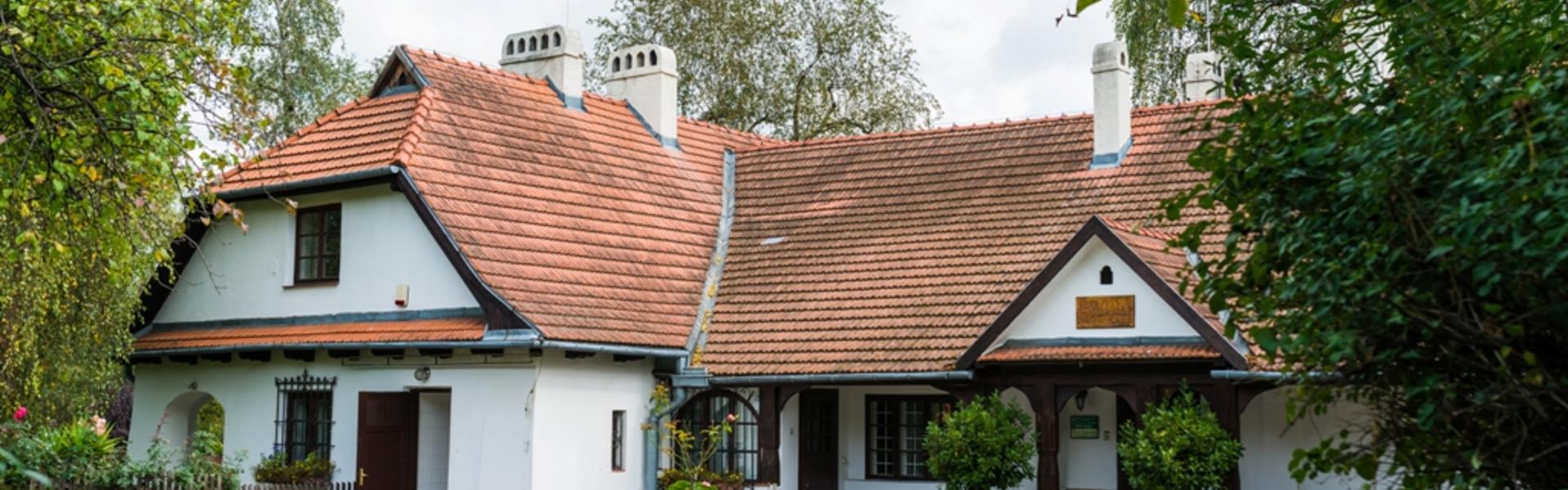 A white manor house among greenery